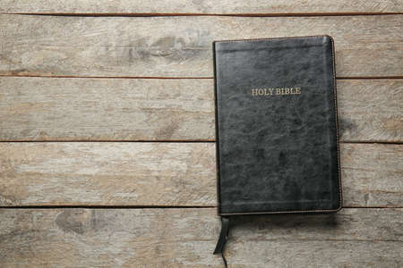 Holy Bible on wooden background