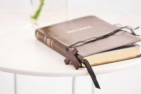 Holy Bible on table in room