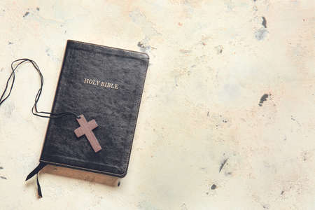 Holy Bible and cross on light backgroundの写真素材