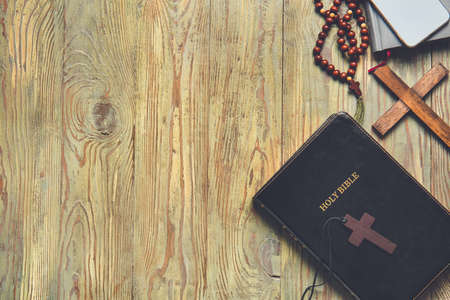Holy Bible and crosses on wooden backgroundの写真素材