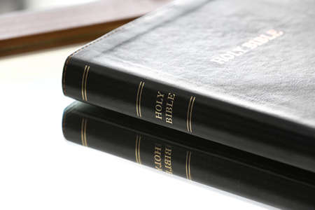 Holy Bible on table in roomの写真素材