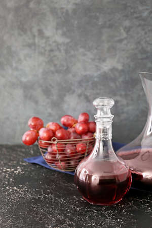 Decanters of wine on gray backgroundの写真素材