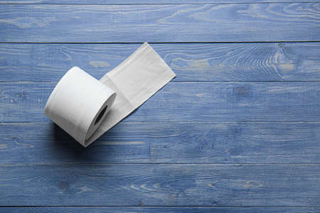 Roll of toilet paper on wooden backgroundの写真素材