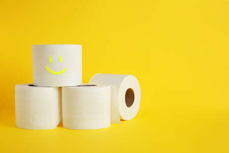 Rolls of toilet paper on color backgroundの写真素材