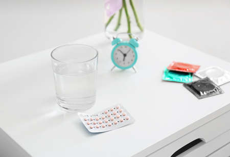 Different means of contraception on bedside tableの写真素材