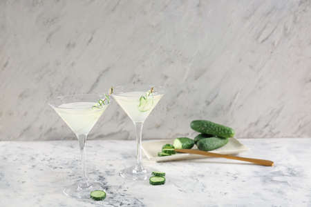 Glasses of tasty cucumber martini on tableの写真素材