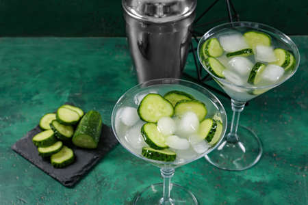 Glasses of tasty cucumber martini on tableの写真素材