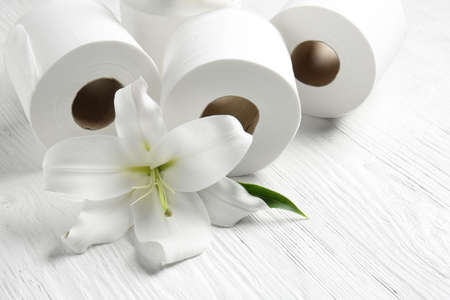 Rolls of toilet paper on white wooden backgroundの写真素材