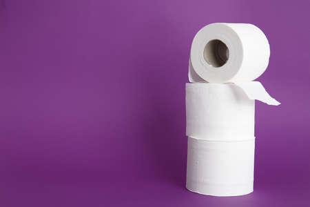 Rolls of toilet paper on color backgroundの写真素材