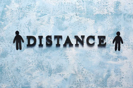 Human figures with word DISTANCE on color backgroundの写真素材
