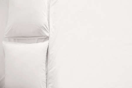 Big comfortable bed with clean linen in room, top view