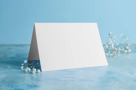 Blank card and flowers on tableの写真素材