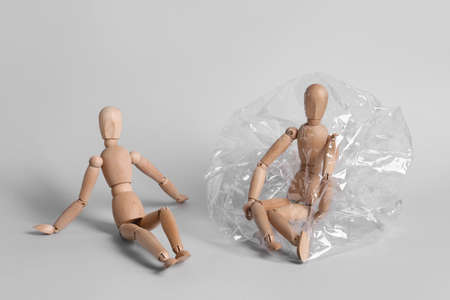 Mannequins on gray background. Concept of social distanceの写真素材