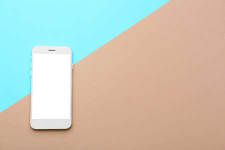 Modern mobile phone on color backgroundの写真素材