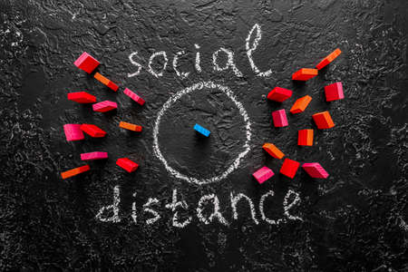 Composition with blocks and text SOCIAL DISTANCE on dark backgroundの写真素材