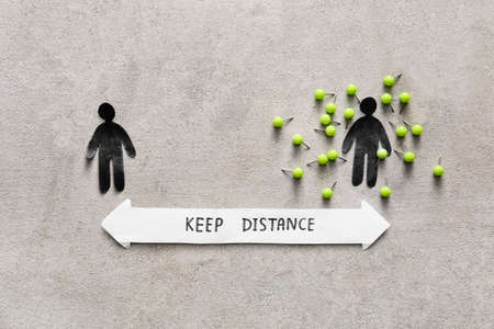 Human figures with text KEEP DISTANCE on grunge backgroundの写真素材