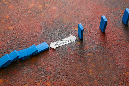 Composition with blocks on color background. Concept of social distance