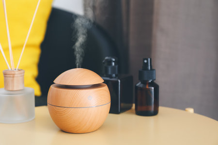 Aroma oil diffuser on table in room