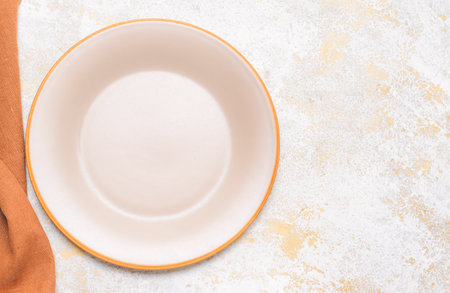 Clean plate with napkin on white backgroundの写真素材