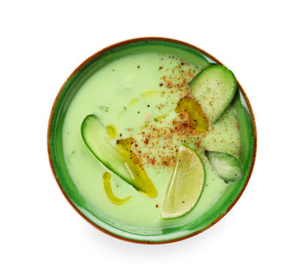 Bowl with cold cucumber soup on white backgroundの写真素材