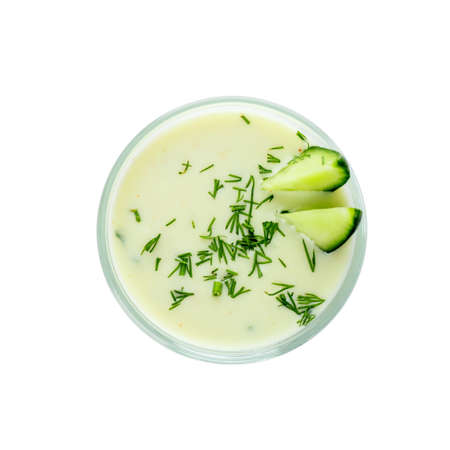 Glass with cold cucumber soup on white backgroundの写真素材
