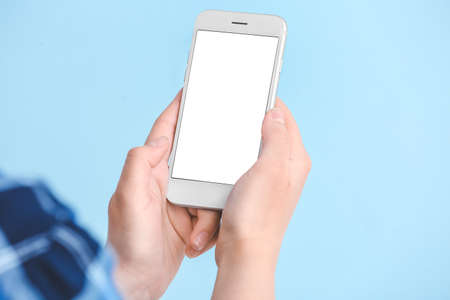 Woman with mobile phone on color background