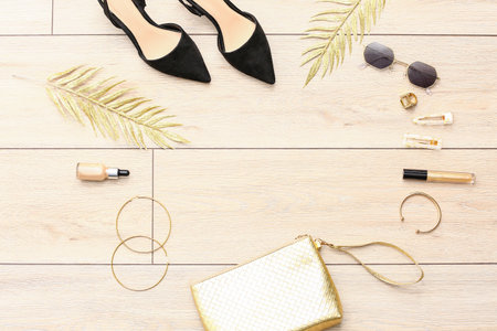 Set of female accessories on light wooden backgroundの写真素材