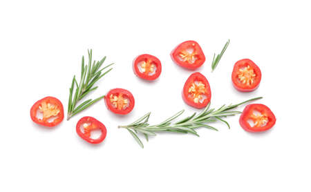 Hot cut chili pepper and rosemary on white backgroundの写真素材