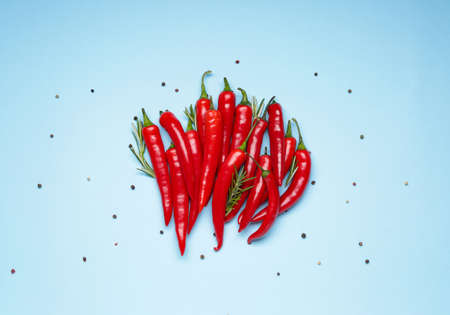 Hot chili pepper on color backgroundの写真素材