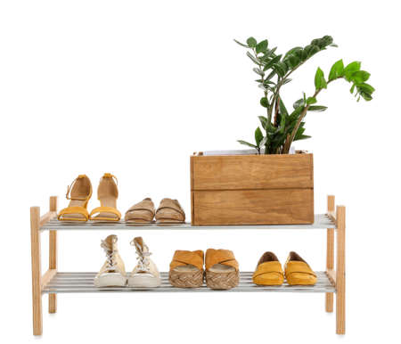 Stand with stylish shoes on white backgroundの写真素材