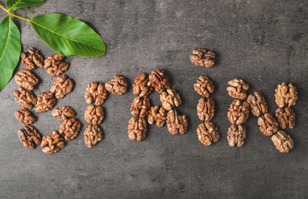 Word BRAIN made of tasty walnuts on gray backgroundの写真素材