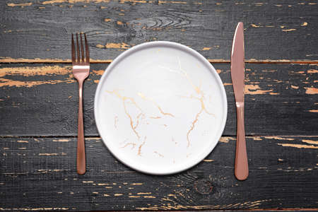 Simple table setting on wooden backgroundの写真素材