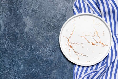 Ceramic plate and napkin on gray backgroundの写真素材