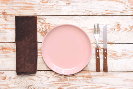 Simple table setting on wooden backgroundの写真素材