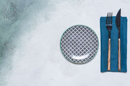 Simple table setting on color background