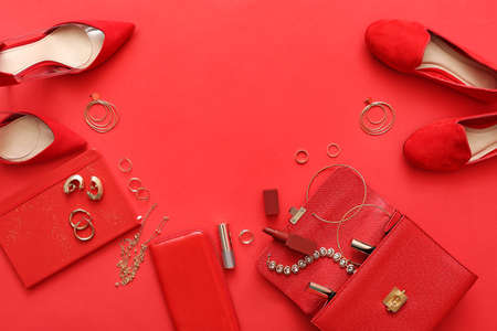 Female accessories on color background