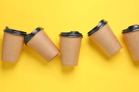Takeaway cups for drink on color backgroundの写真素材