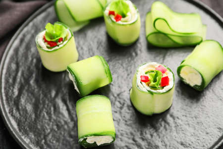 Plate with tasty cucumber rolls, closeupの写真素材