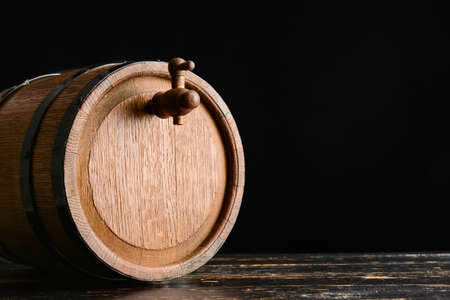 Wooden barrel of wine on dark backgroundの写真素材
