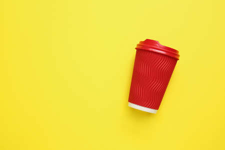 Takeaway cup for drink on color backgroundの写真素材
