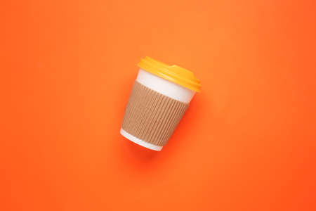 Takeaway cup for drink on color backgroundの写真素材