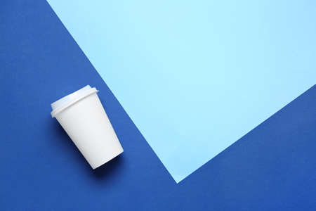 Takeaway cup for drink on color backgroundの写真素材