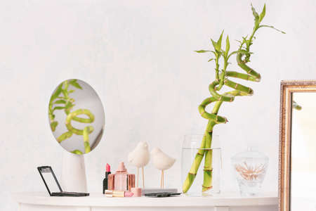 Set of makeup cosmetics with mirror on tableの写真素材