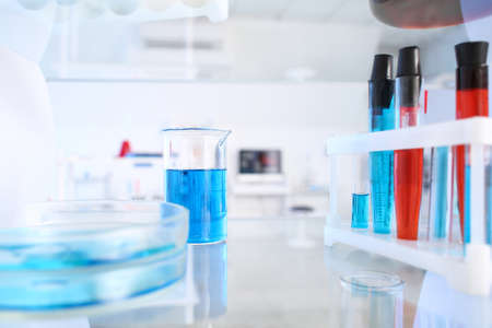 Glassware with samples on shelf in laboratoryの写真素材