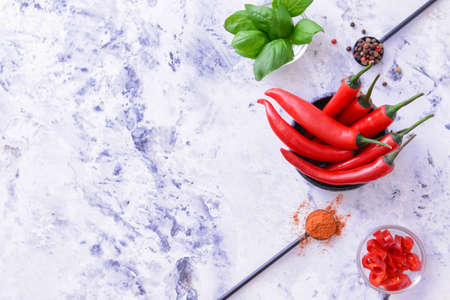 Hot chili pepper with spices on white backgroundの写真素材