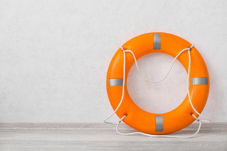 Lifebuoy ring near light wallの写真素材