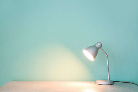 Glowing lamp on table in roomの写真素材