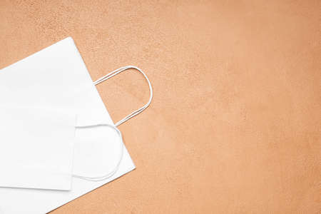 Paper shopping bags on color backgroundの写真素材