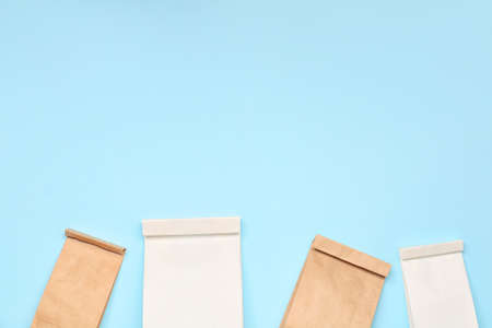 Paper bags on color background