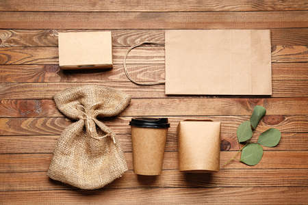 Eco containers for food and drinks on wooden backgroundの写真素材